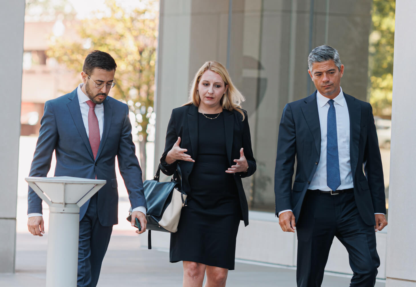 Three SKO Attorneys walking outside.