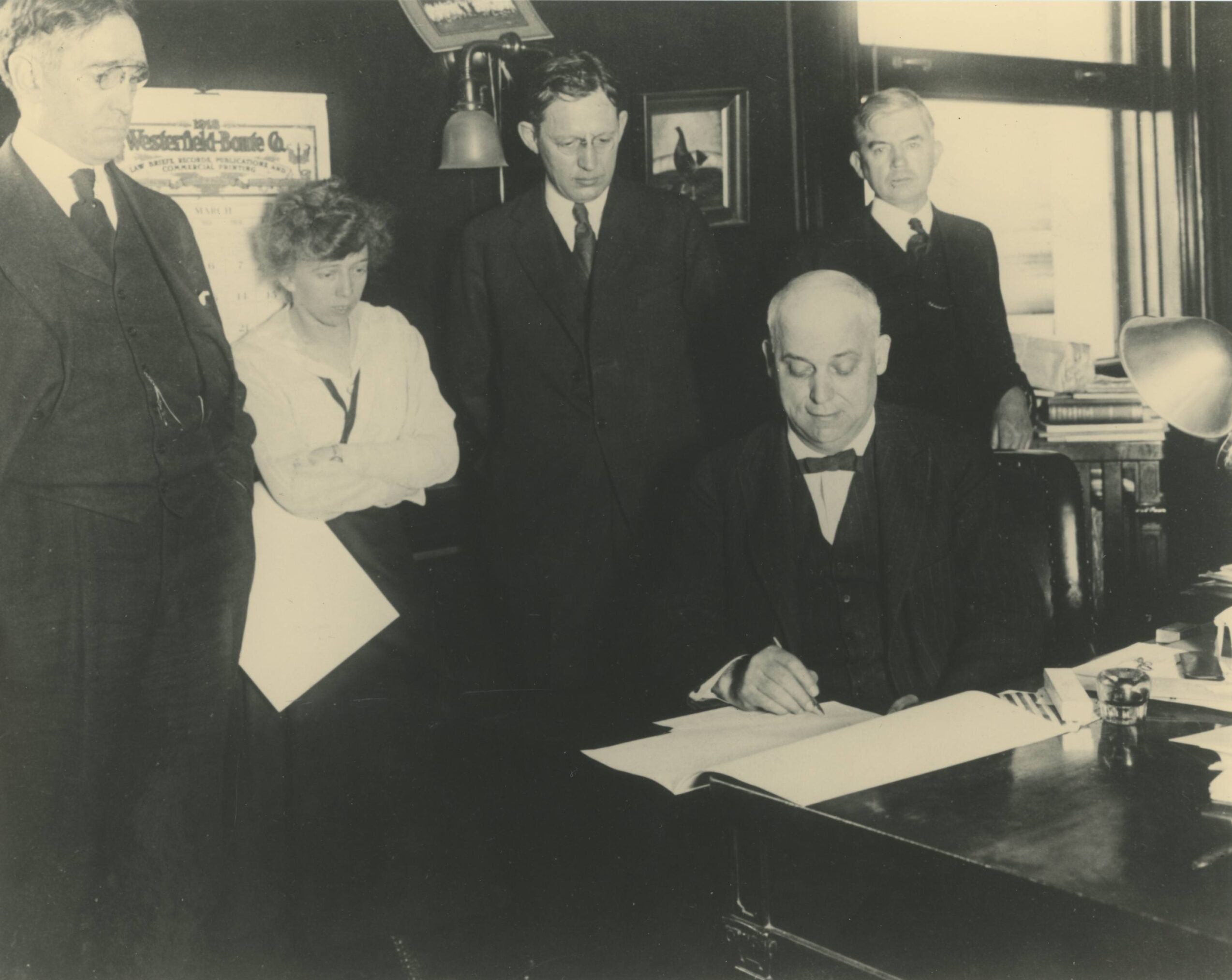 Richard Stoll, Wallace Muir, William Townsend, James Park signing a document