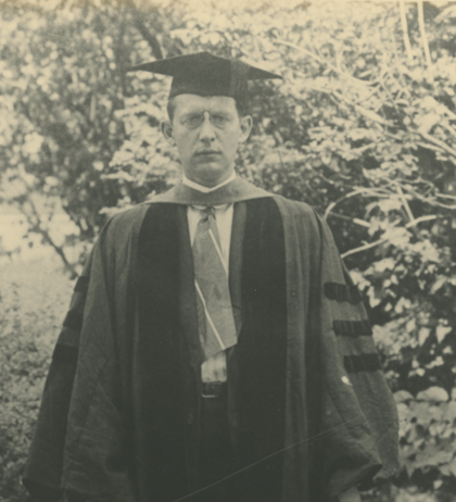 Richard Stoll in a graduation cap and gown.